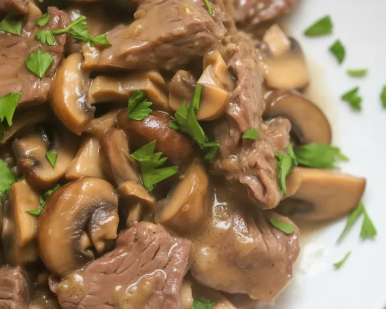 Beef tenderloin tips served in mushroom gravy with garlic butter, a succulent recipe.